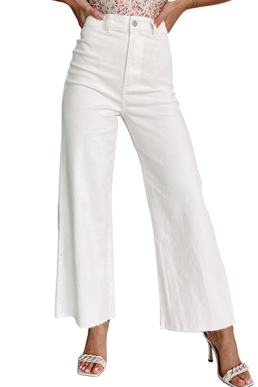 These Solid Raw Hem Wide Leg Crop Jeans raise the fashion bar. The wide-leg design and raw hem embody edgy style. The cropped length brings the look to the next level. Amp up your wardrobe and go from casual t-shirt and sneaks to dressy blouses and heels in no time. Made from a comfortable blend of 98% cotton and 2% elastane.