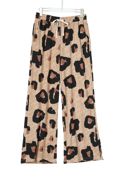 These relaxed trousers are a hit with stylish ladies! Get wild with the leopard-print pattern and drawstring style. Crafted from comfy stretch-fabric in an ultra-loose fit that flatters any figure. Throw on any blouses or tees to get a laid-back fashionable vibe.