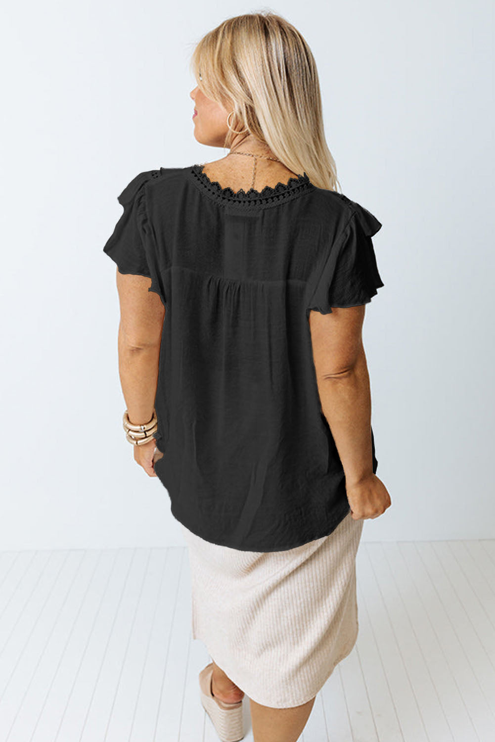 This Curvy blouse has it all—from lightweight material and crochet details to a v-neck and flutter sleeves. The relaxed fit flatters most shapes and looks great with pants or skirts! 55% Viscose, 45% Polyester. Pick it up in Black or Rose.