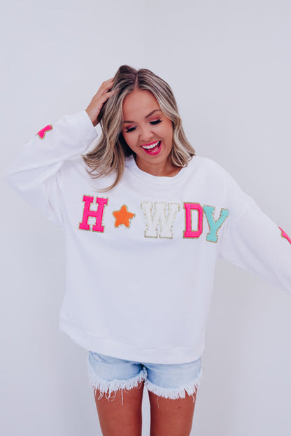 Vamp up your wardrobe with this fun pullover sweatshirt! The dazzling "HOWDY" graphic gives it a touch of pizzazz, and the star patterns on the sleeves make it extra darling. Made of 65% Polyester and 35% Cotton, you can choose from Black or White. Moodz Boutique has you covered!