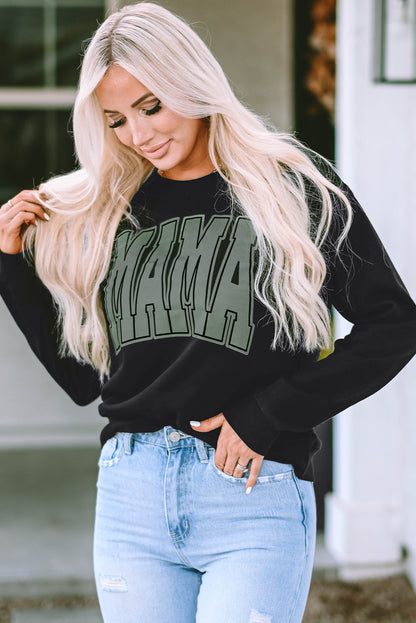 This MAMA graphic pullover sweatshirt is a perfect blend of classic and fashionable. Its loose-fitting drop-shoulder style is perfect for layering over jeans and joggers. Crafted from a cozy blend of 65% Polyester and 35% Cotton, it comes in classic black and is exclusively available from Moodz Boutique.