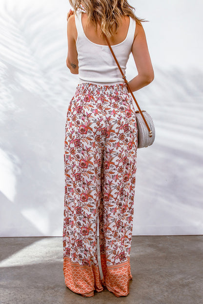 Pantalones de pierna ancha y cintura alta con frunces y estampado floral rojo