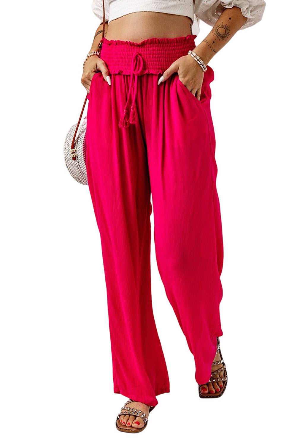 These pants will keep you lookin' sassy and comfy! The smocked waist brings the unique, and they slip on with ease. The wide legs flatter your pins, while the lightweight, 100% viscose fabric's as breezy as it is chic. Rose color--so you can bloom!