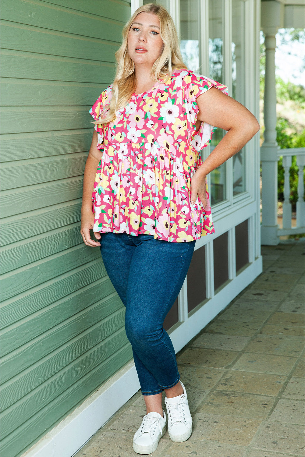 Blusa con cuello redondo y mangas abullonadas con estampado floral en rosa