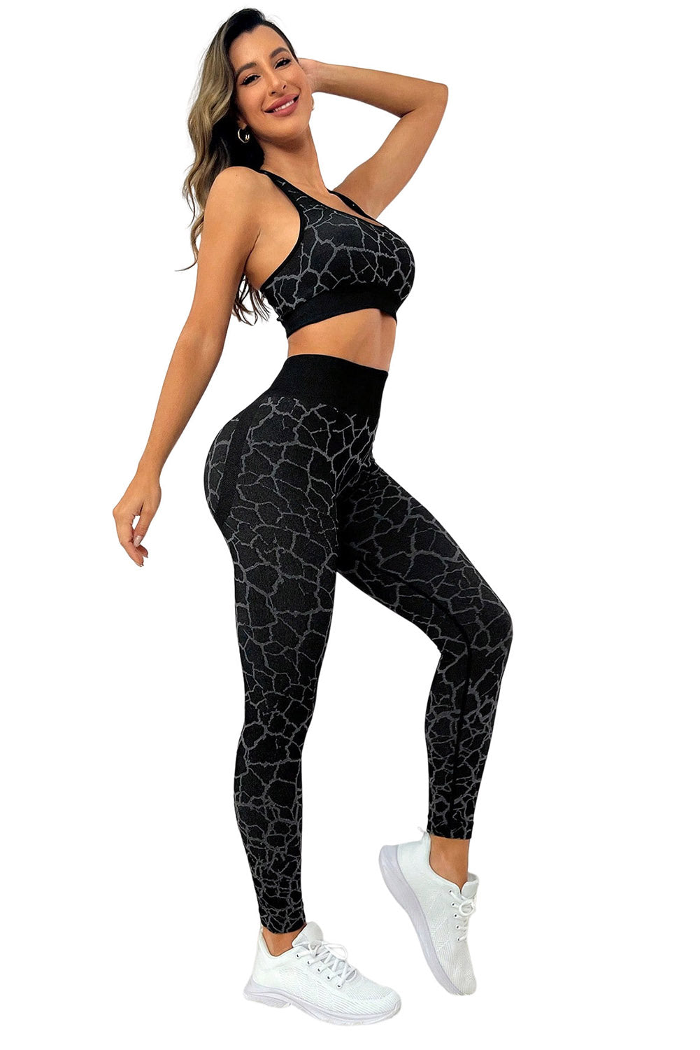 Unleash your wild side with our Animal Print Booty-Boost High Waist Active Set! The racerback top offers the max in mobility and comfort during all activities, while the wide waistband guarantees a snug fit and tummy control. The stylish pattern adds a bold and fashionable flair to your getup, and the booty lift design adds ah-mazing sexiness. Perfect for active lifestyles, this set is perfect for workouts - or just casual loungin'! Comes in Black.