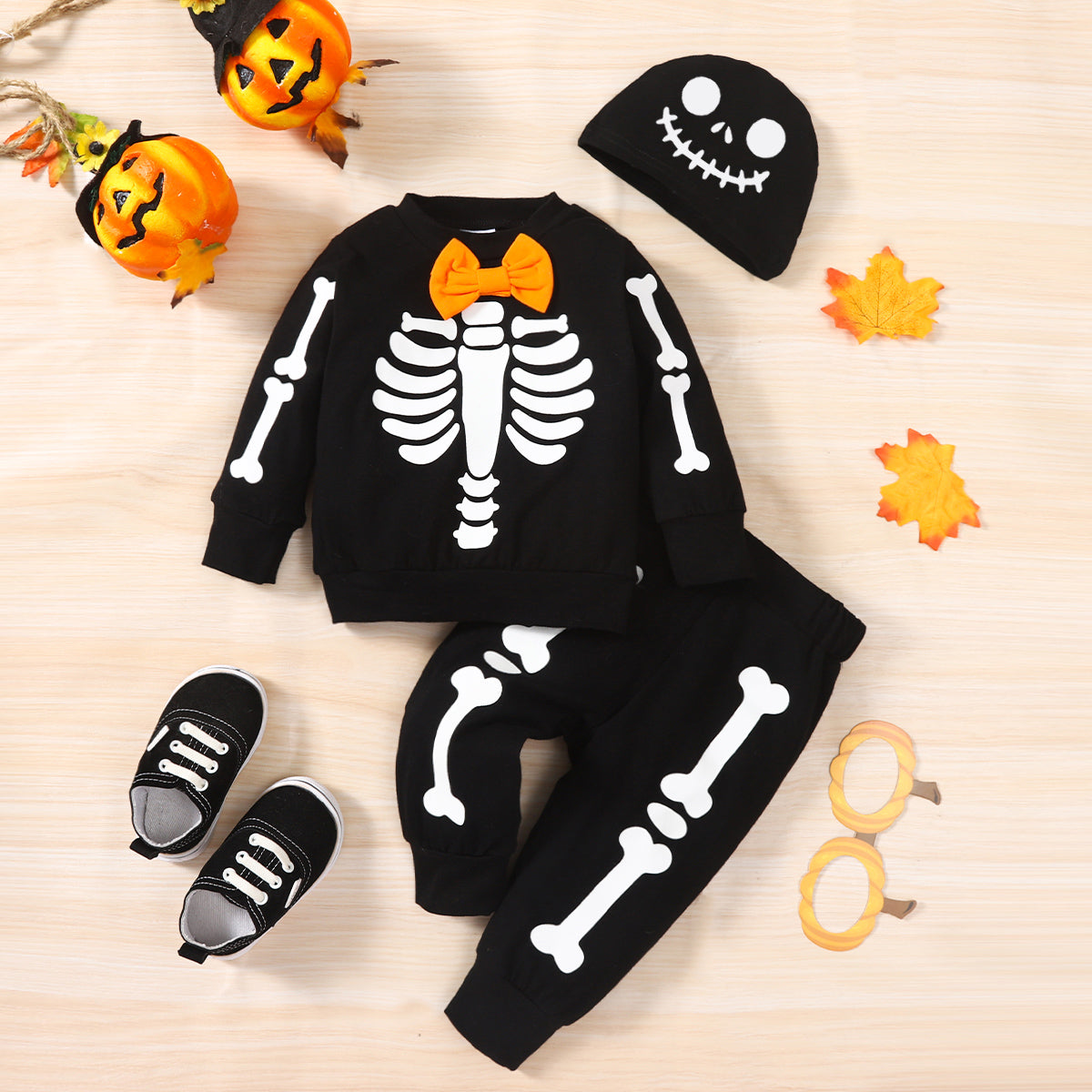 Score this 3-piece set: Hat, Sweatshirt, and Pants with a graphic baby skeleton print that glows in the dark! It features a bow neckline, long regular sleeves, and a material composition of 95% cotton and 5% spandex. So comfy and stylish!