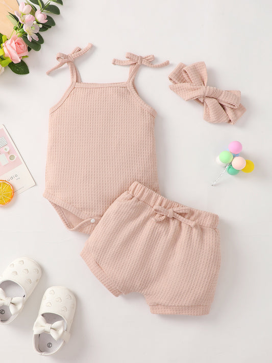 Outfit your little one in style with our adorable Onesie and Shorts Set! Featuring a fashionable headband, this lovely ensemble is crafted with 95% polyester and 5% spandex for a comfortable fit. Choose from two stylish colors: pink or green.