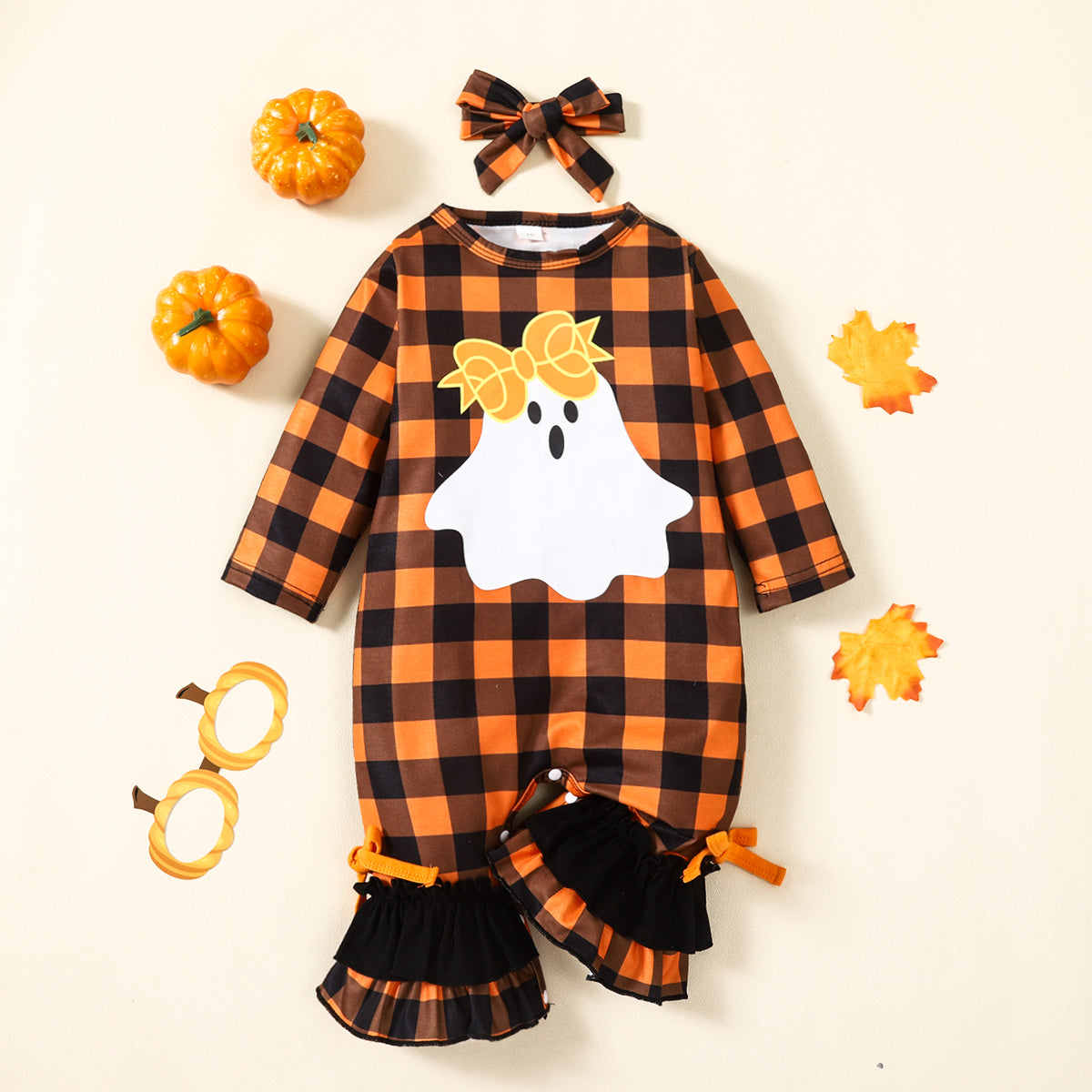 Show off your sizzlin' style in this Plaid Ghost Graphic Jumpsuit! It's got a ruffled bow, long sleeves, and is available in baby and toddler sizes. Plus, it's made from a cozy 95% polyester and 5% spandex blend. What's not to love?