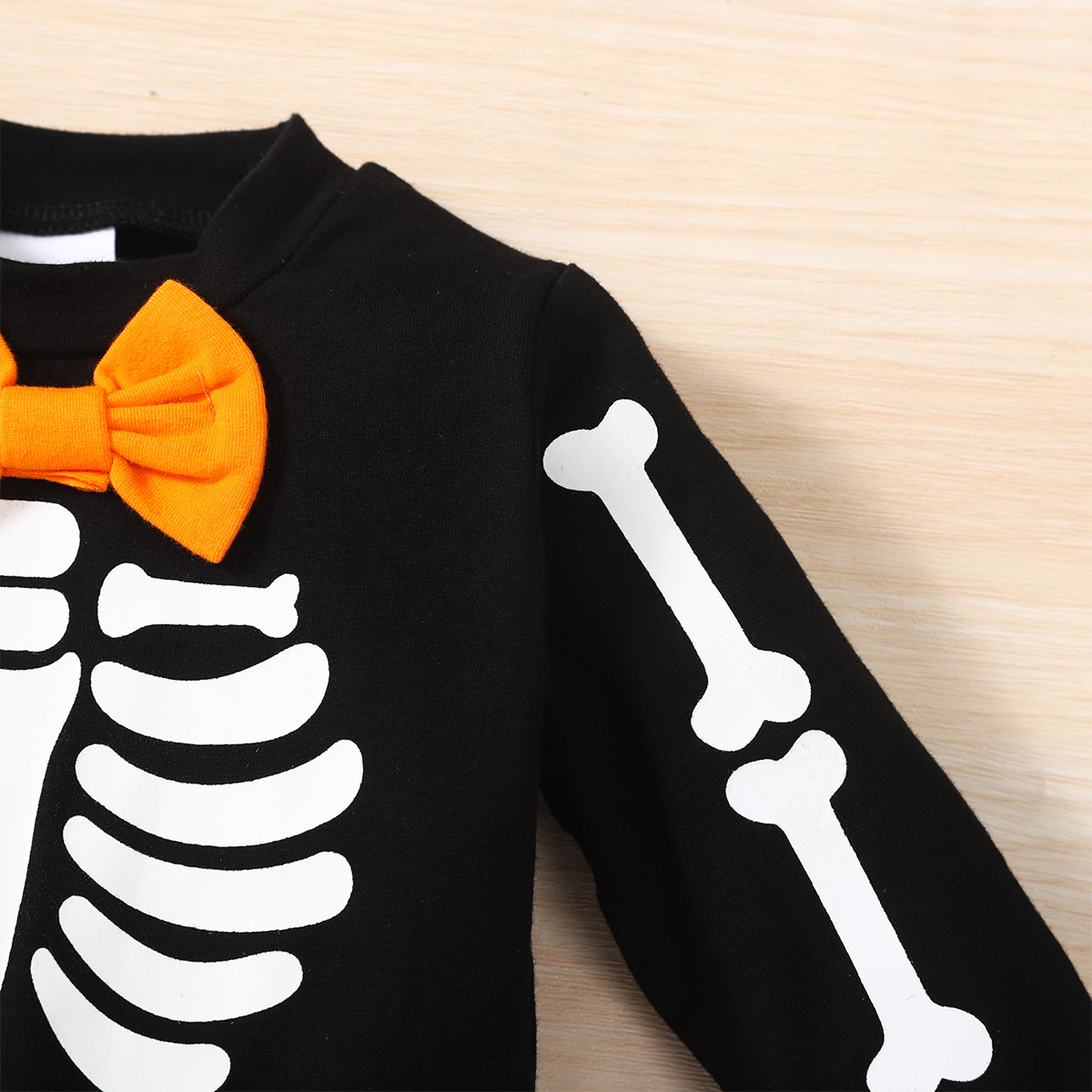 Score this 3-piece set: Hat, Sweatshirt, and Pants with a graphic baby skeleton print that glows in the dark! It features a bow neckline, long regular sleeves, and a material composition of 95% cotton and 5% spandex. So comfy and stylish!