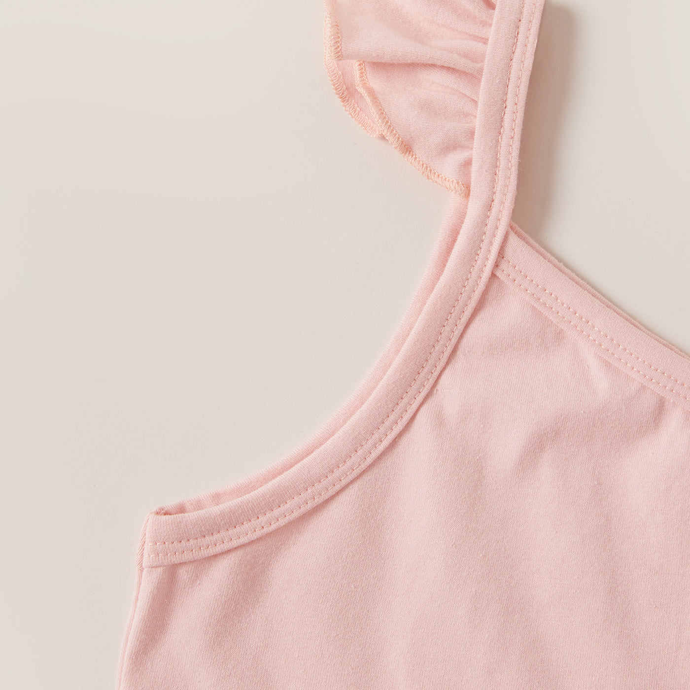 This Peach Top & Rainbow Shorts Set is chic and timeless, crafted from a delicate cotton blend and featuring an asymmetrical neckline with sleeveless construction. Exquisite in its tailoring and delightful to the touch, this premium set is available in Toddler and Girl sizes.