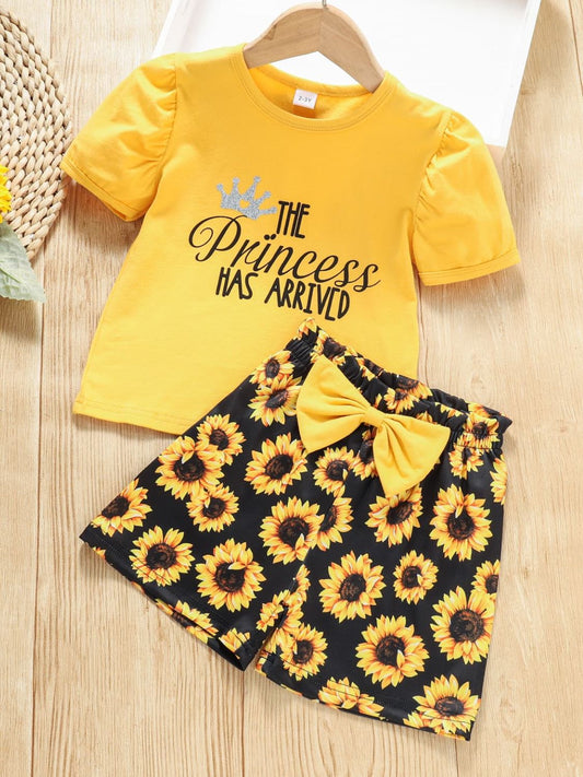 For the fashion-forward little girls, our chic Graphic Top and Sunflower Print Shorts Set is available in both toddler and girl sizes. The top features a round neckline, short regular-length sleeves crafted from 95% cotton and 5% spandex. The bottoms are made of 95% polyester and 5% spandex and exhibit a sunflower pattern.