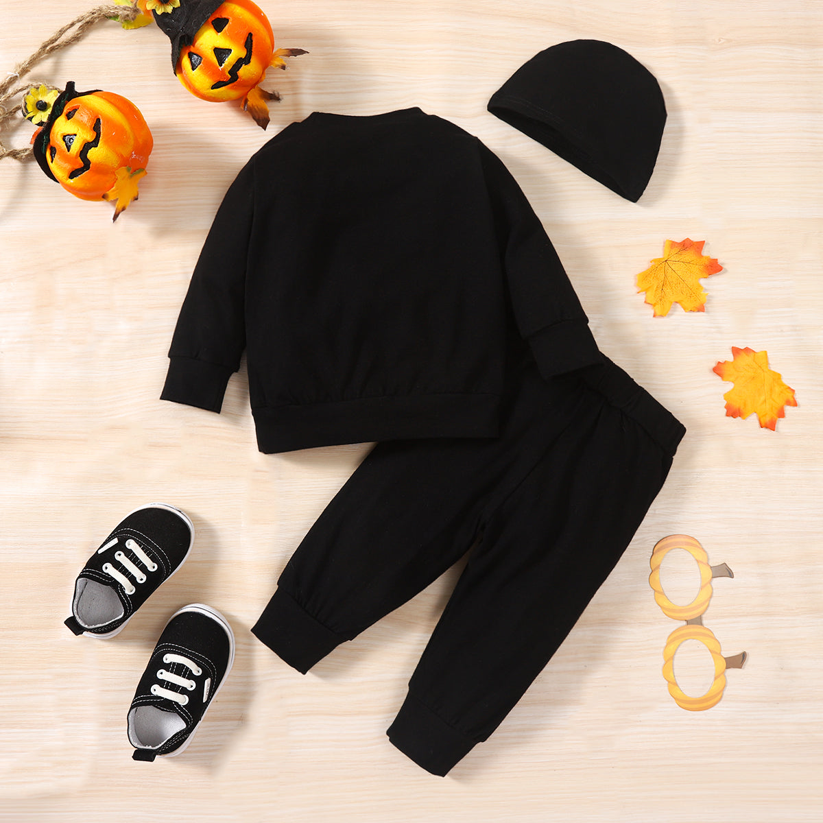 Score this 3-piece set: Hat, Sweatshirt, and Pants with a graphic baby skeleton print that glows in the dark! It features a bow neckline, long regular sleeves, and a material composition of 95% cotton and 5% spandex. So comfy and stylish!