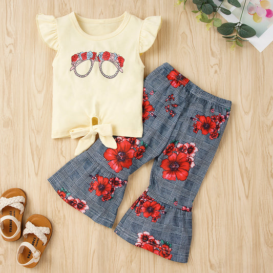 This two-piece Graphic Tie Hem Top and Floral Flare Pants Set will add a delightful touch of chic to your wardrobe! It features an eye-catching graphic pattern, a bow detail, and a stylish round neck. Show off those beautiful arms with the short flutter sleeves! 95% cotton and 5% spandex make this set comfortable and breathable.