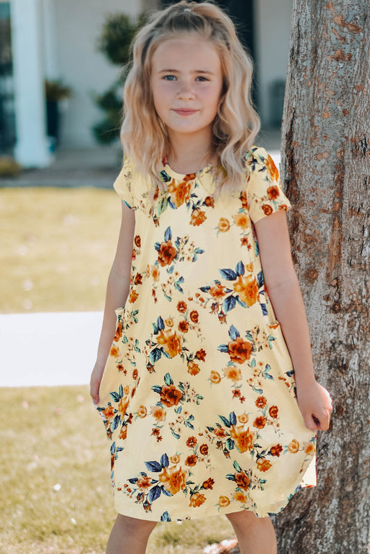 Vestido de niña con cuello redondo, manga corta y estampado floral con bolsillos