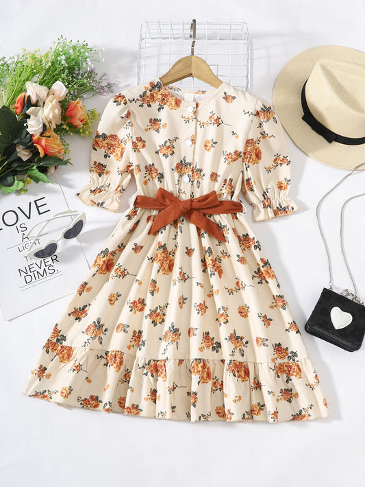 Vestido de niña con mangas abullonadas y lazos florales